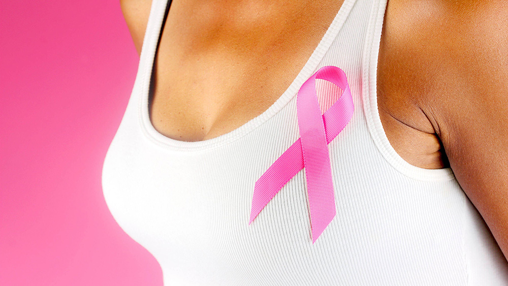 Woman wearing a pink ribbon