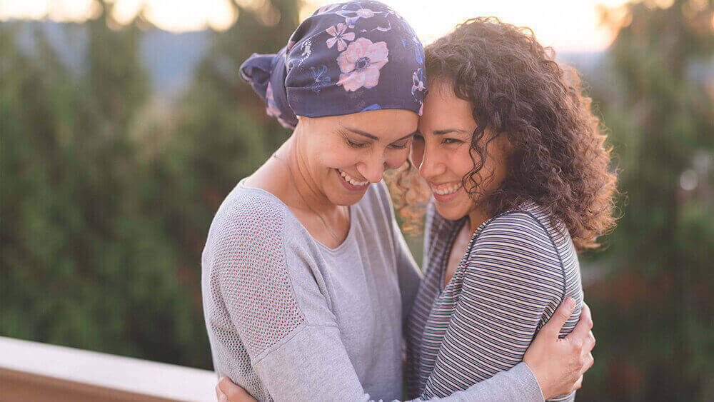 A couple of women embracing