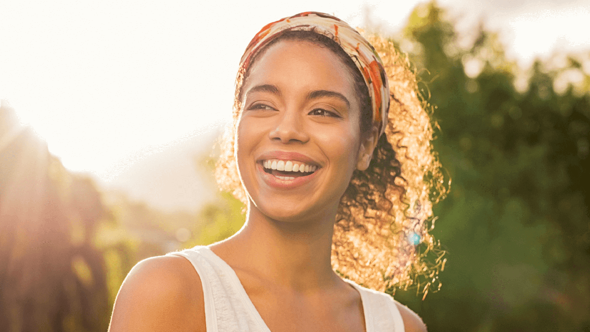 Woman in the sun smiling