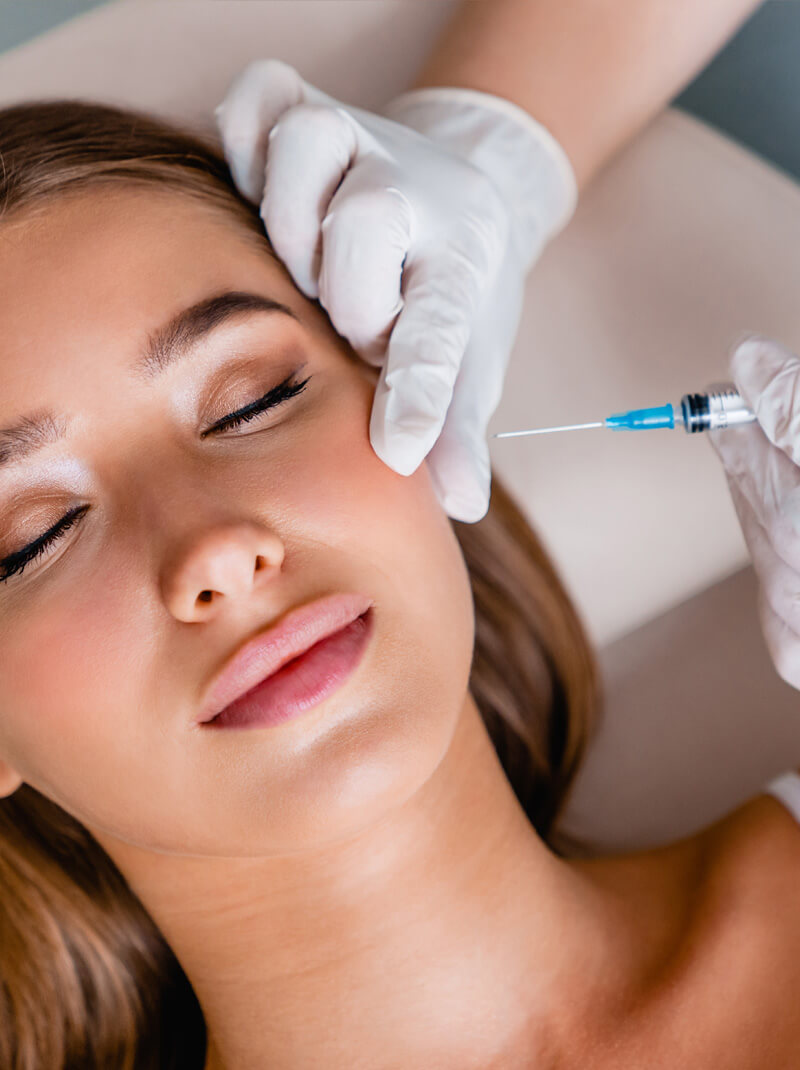 Woman getting a facial injection