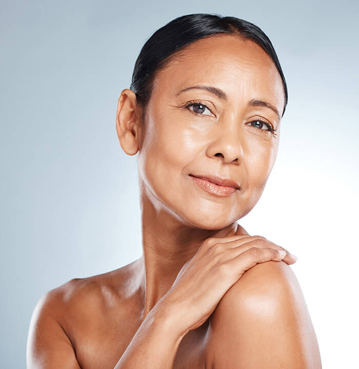 Mature woman with her arms crossed