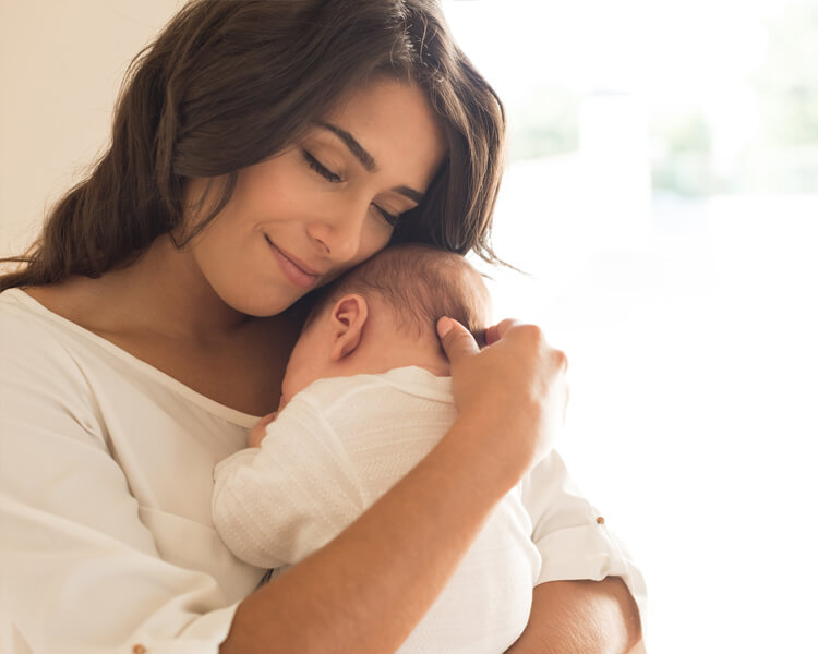 Woman holding a new born baby